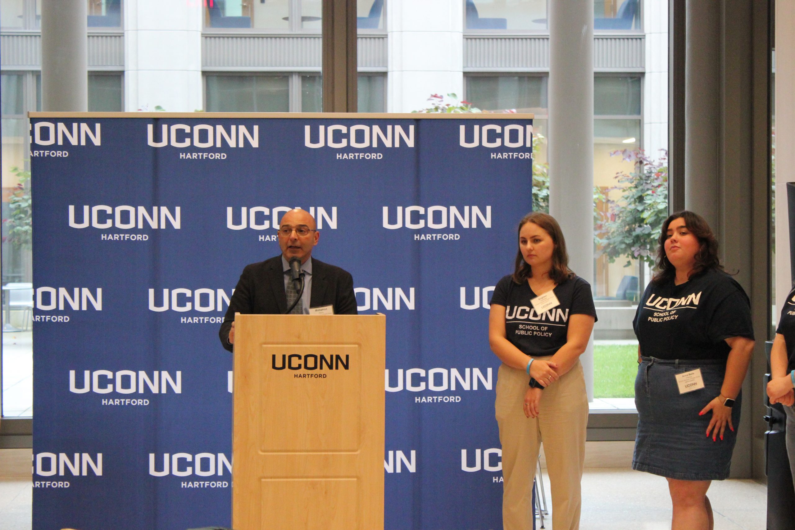 Mohamad Alkadry, Brighten Critchfield and Anna Bella D'Amico at the podium